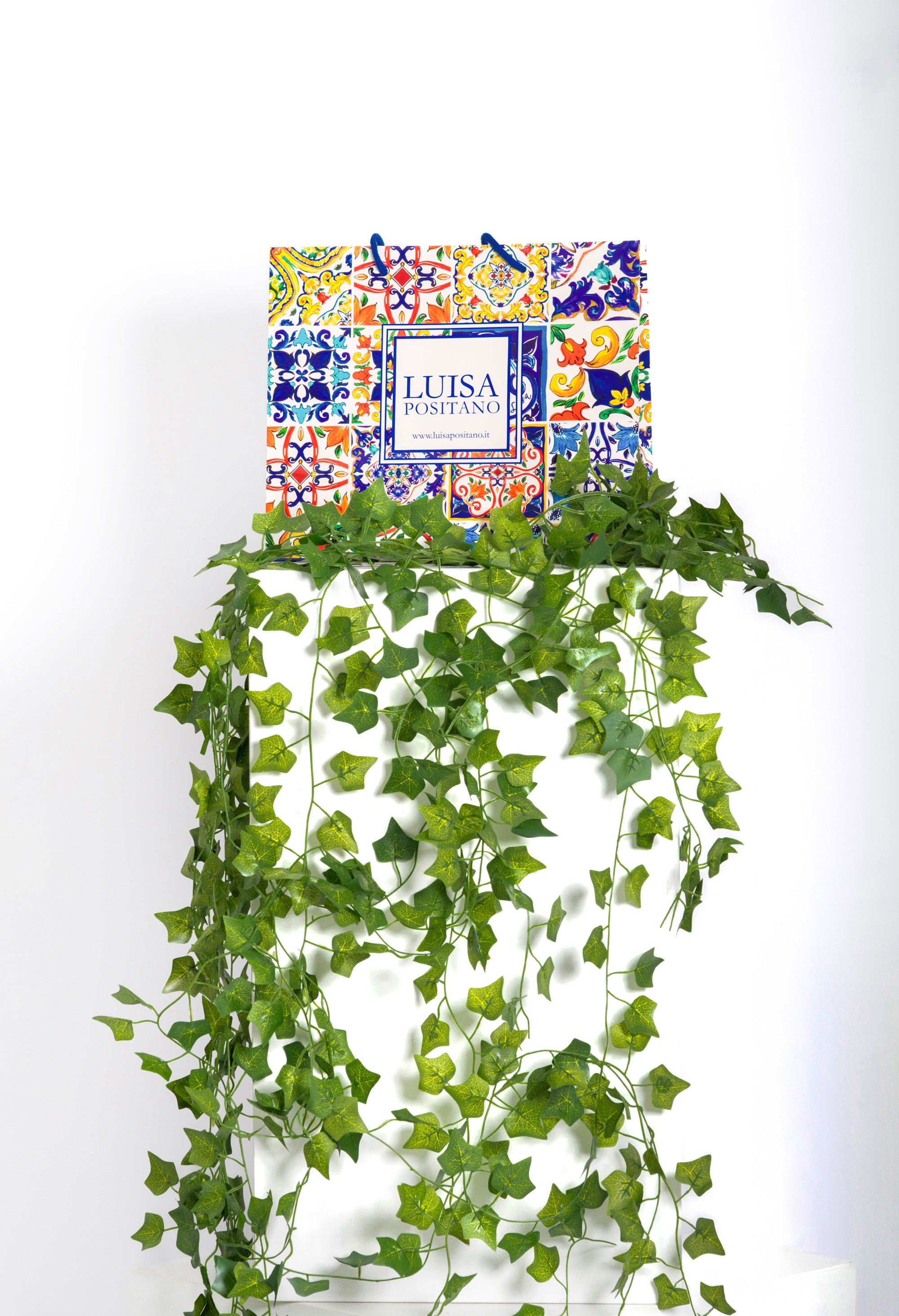 Luisa Positano glossy paper shopper with blue drawstring handle