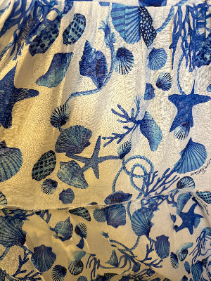 Coral top with bow and linen mini skirt